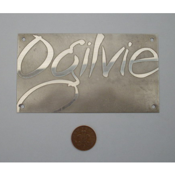 Reverse etched stainless steel plaque